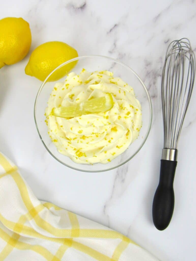 Low Carb/Keto Lemon Cheesecake Mousse in dessert cup next to whisk