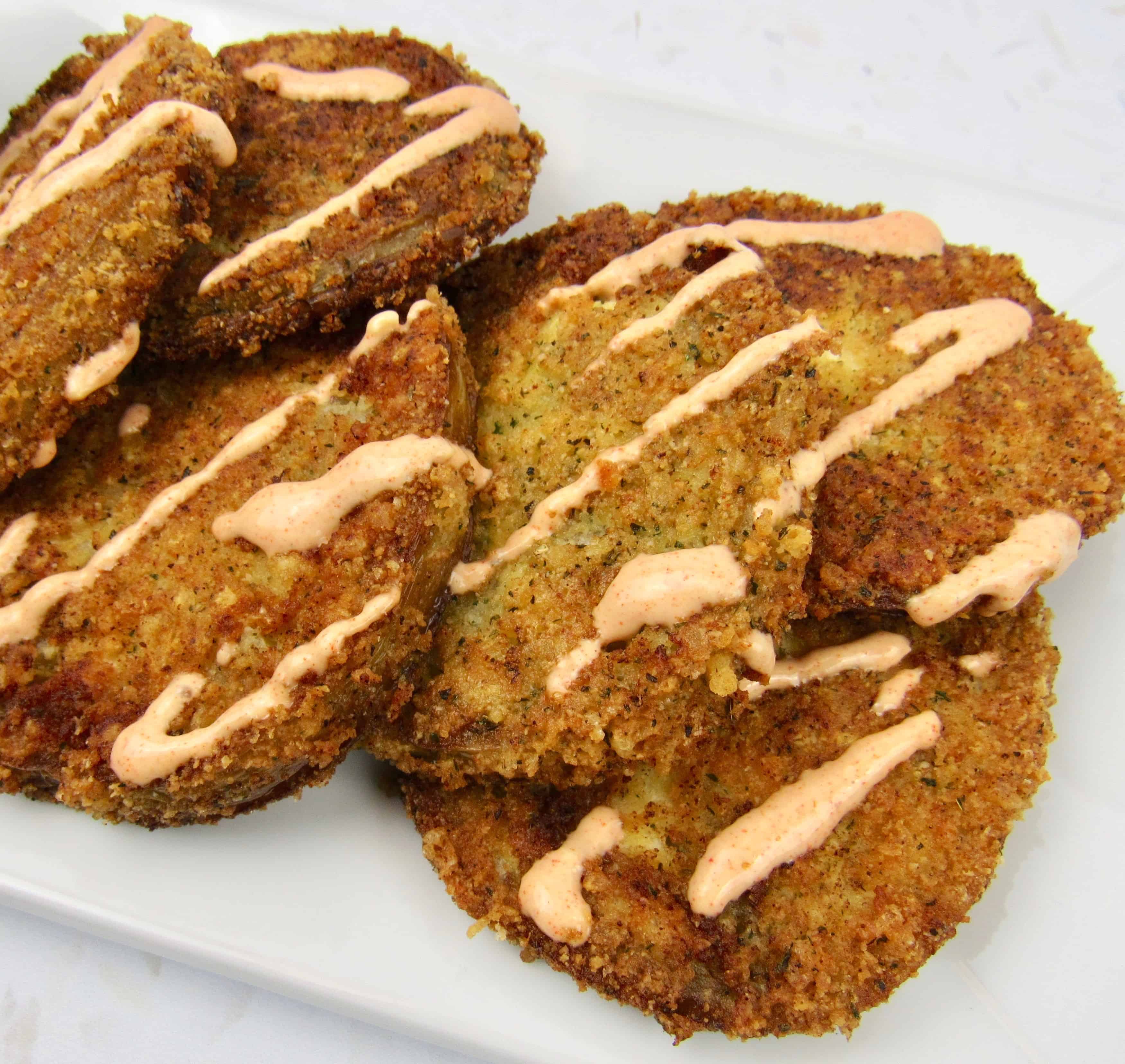 overhead view of fried green tomatoes on white plate