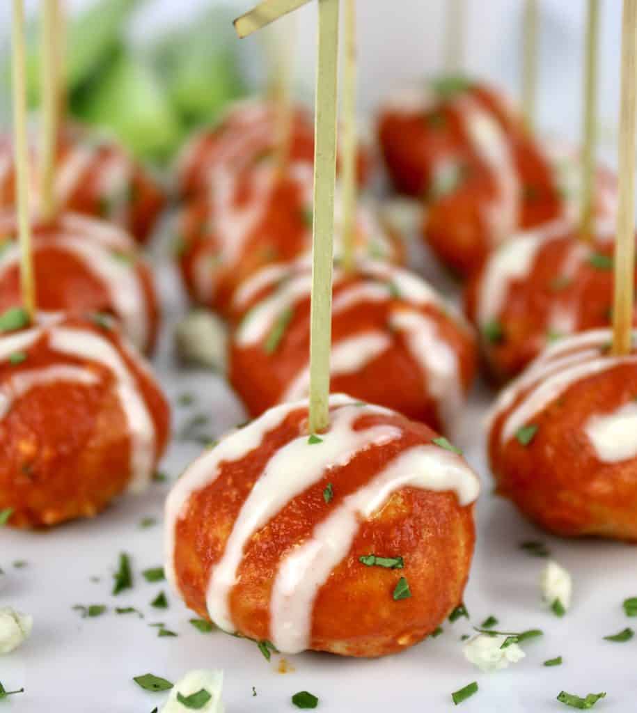 Keto Buffalo Chicken Meatballs with toothpicks on white plate